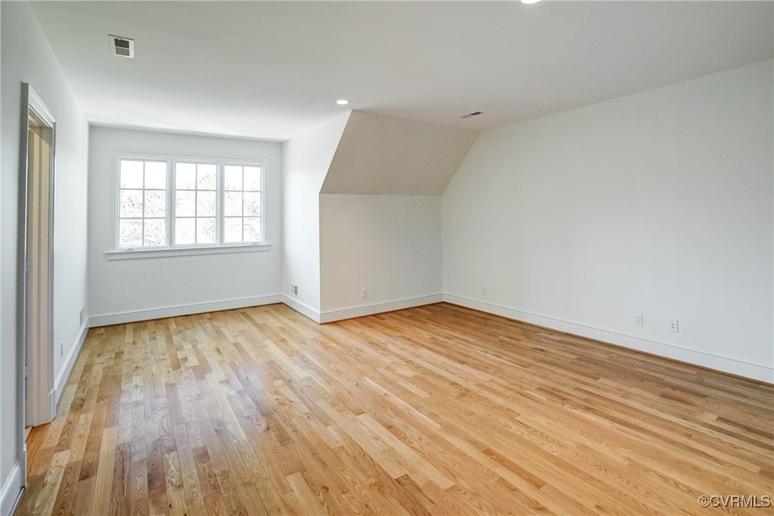 203 Kinloch Road Manakin-Sabot, VA 23103 - Photo 46 of 49 an empty room with wooden floor and windows