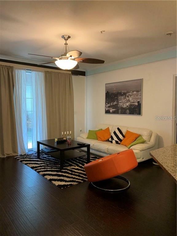 3446 Soho Street, Unit 101 Orlando, FL 32835 - Photo 4 of 9 a living room with furniture pool table and a window