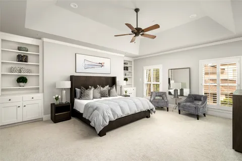 a spacious bedroom with a bed and furniture