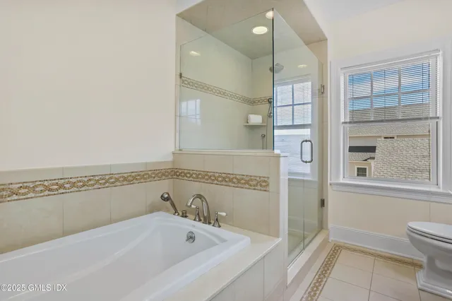 a bathroom with a bathtub and a shower