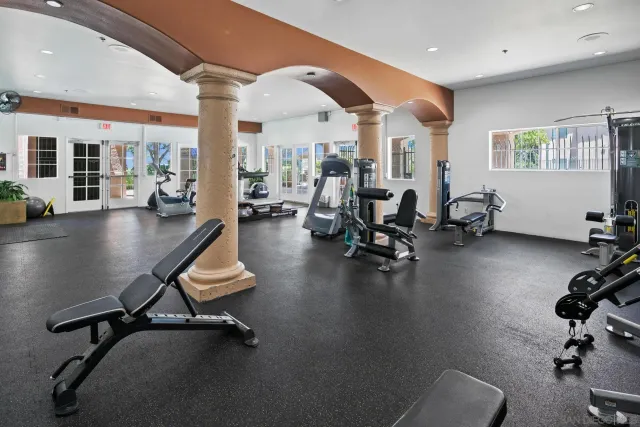 a living room with furniture pool table and a large window
