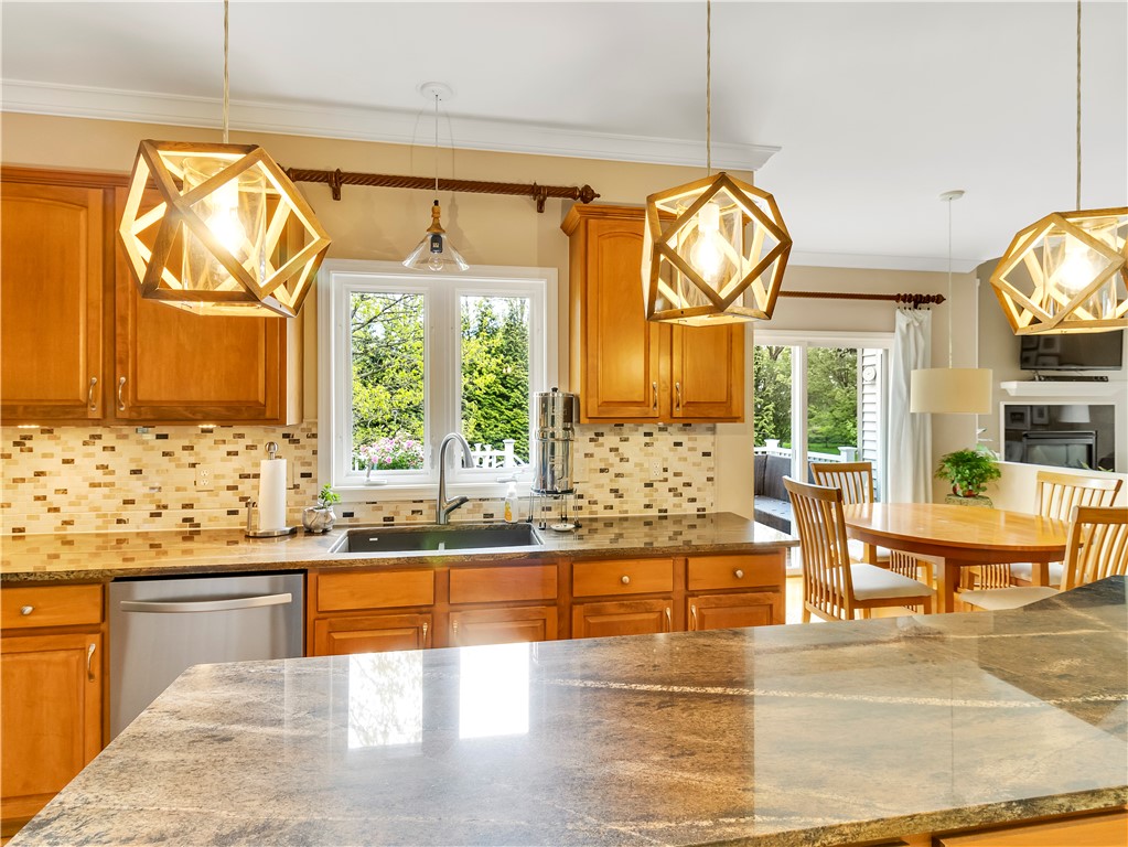 8 Claridge Circle Penfield, NY 14580 - Photo 12 of 47 Granite counters and under cabinet lighting.
