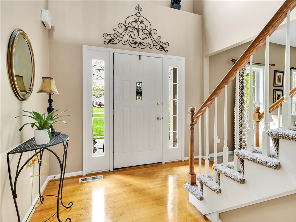 8 Claridge Circle Penfield, NY 14580 - Photo 4 of 47 Open volume foyer with gleaming hardwood!