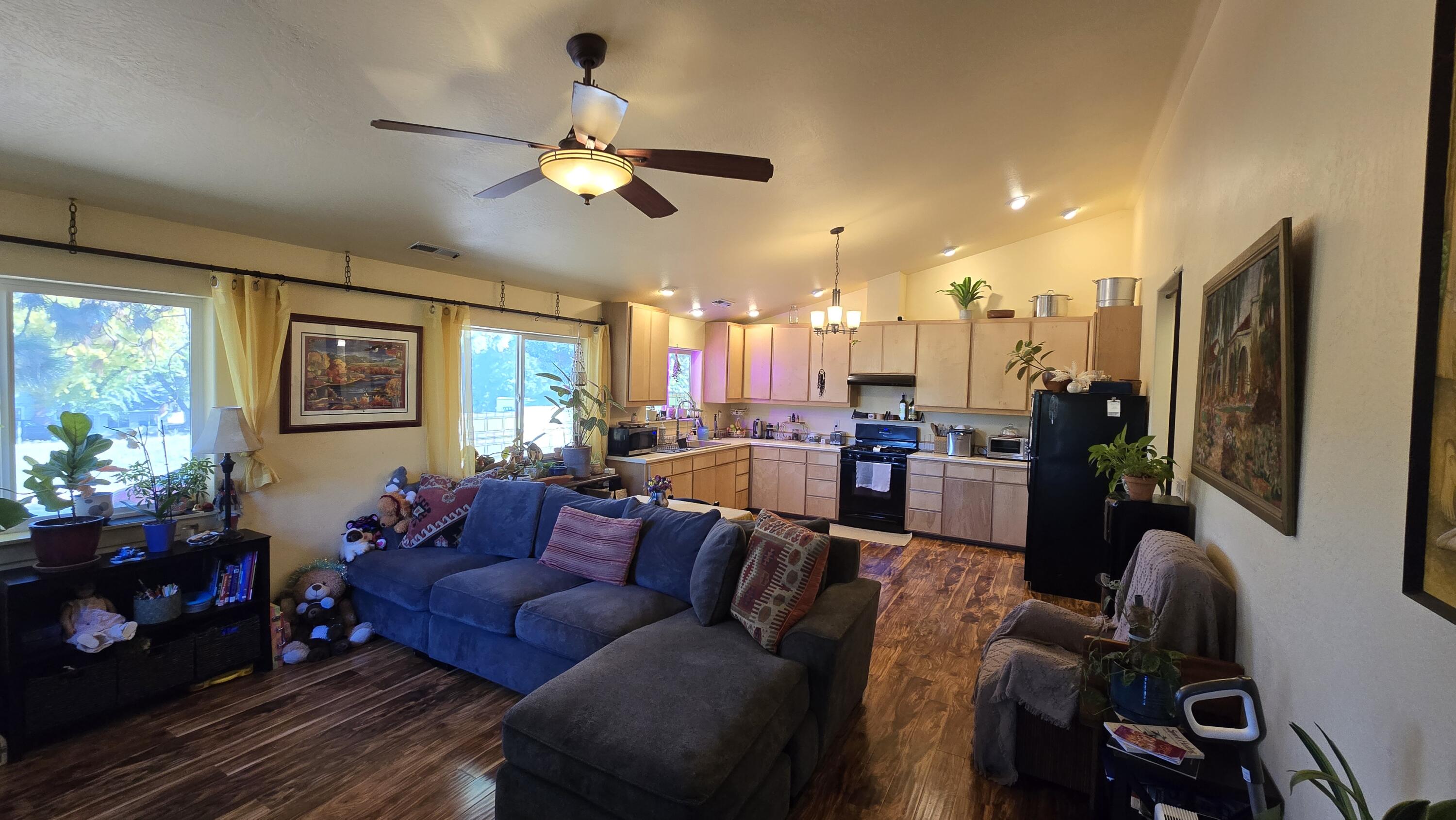 488 Crowson Road Ashland, OR 97520 - Photo 10 of 30 a living room with furniture and a chandelier