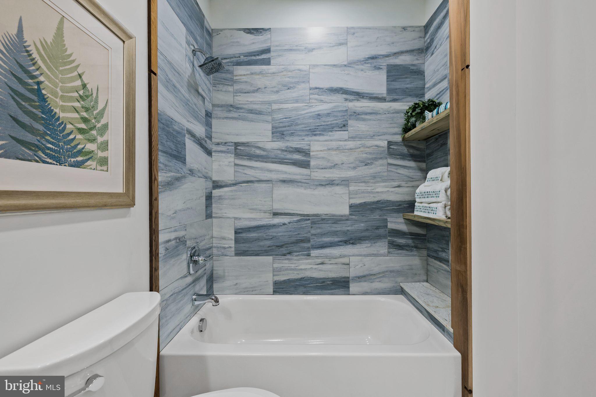 2235 Traceys Store Road Parkton, MD 21120 - Photo 33 of 65 Porcelain tile shower w/reclaimed wood shelving