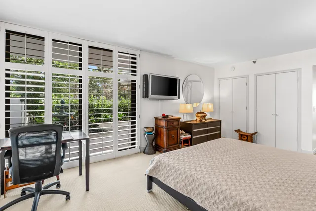 a bedroom with a bed and furniture