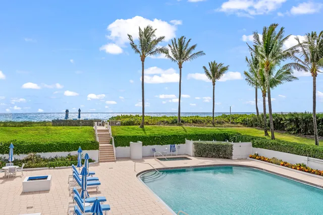 a view of a patio with a table and chairs