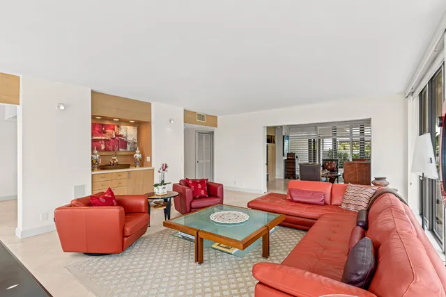 a living room with furniture and a table