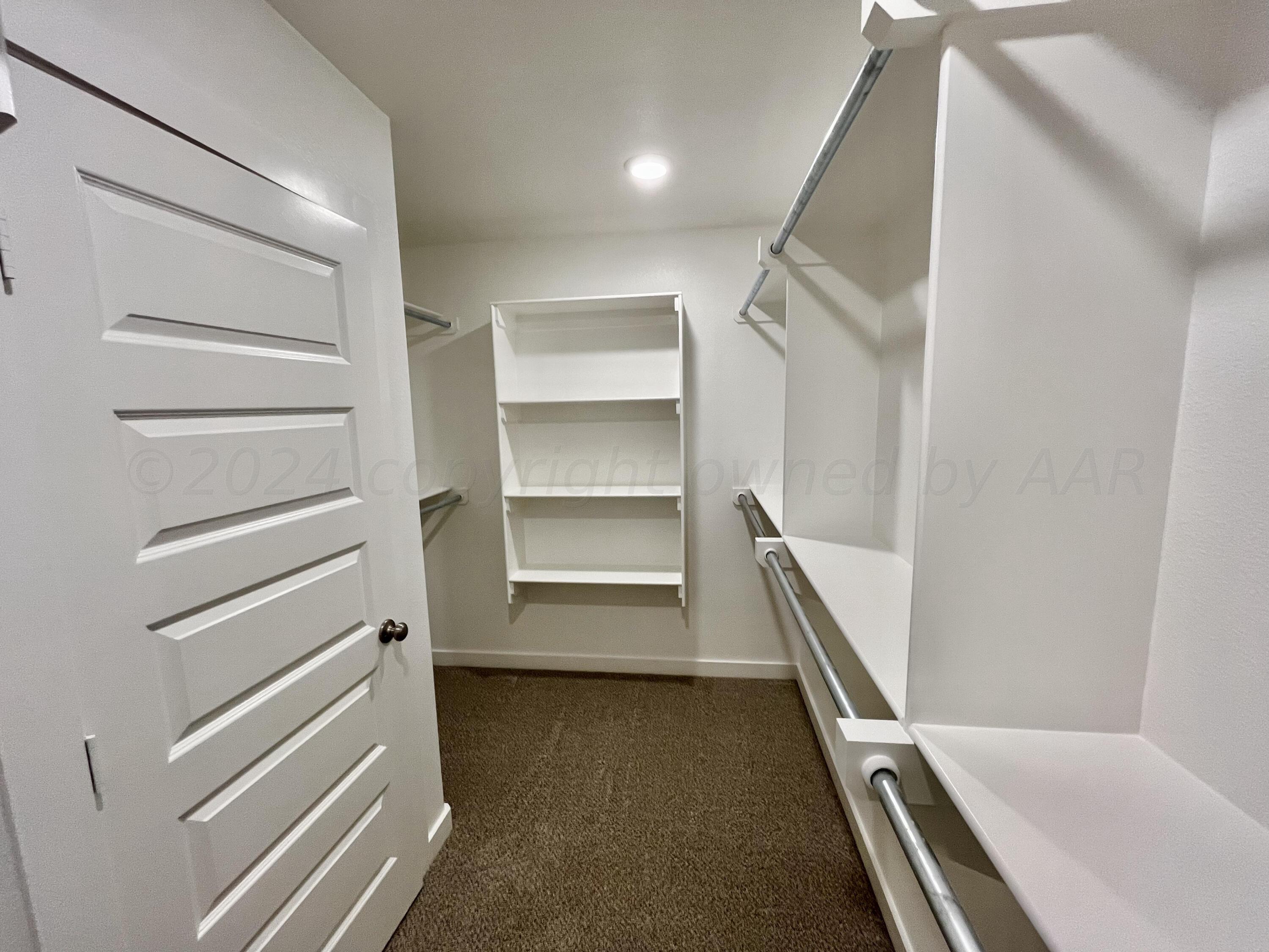 7515 Frazier Road Amarillo, TX 79119 - Photo 15 of 23 a view of an empty walk in closet
