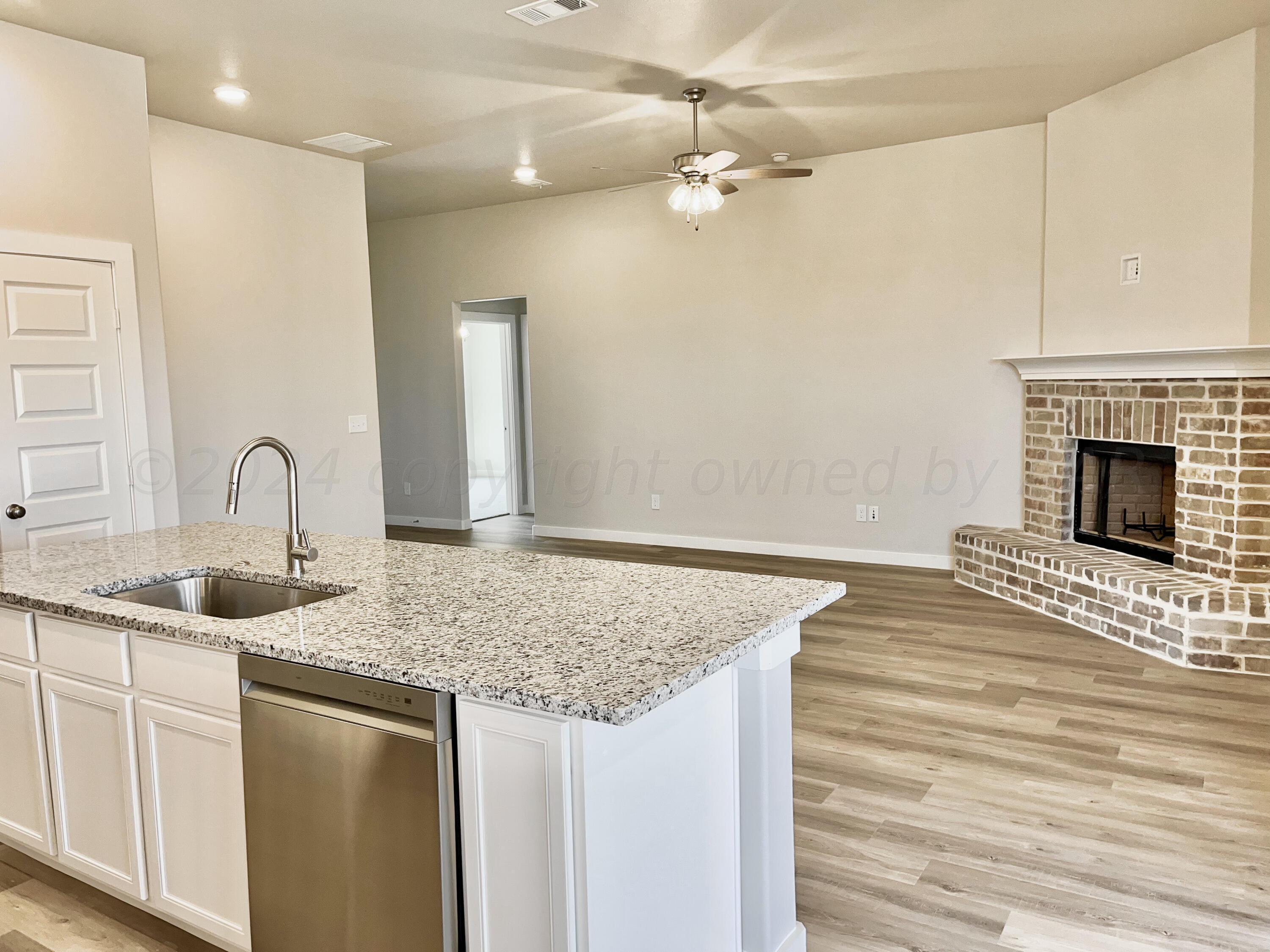 7515 Frazier Road Amarillo, TX 79119 - Photo 9 of 23 a kitchen with stainless steel appliances granite countertop a sink and refrigerator