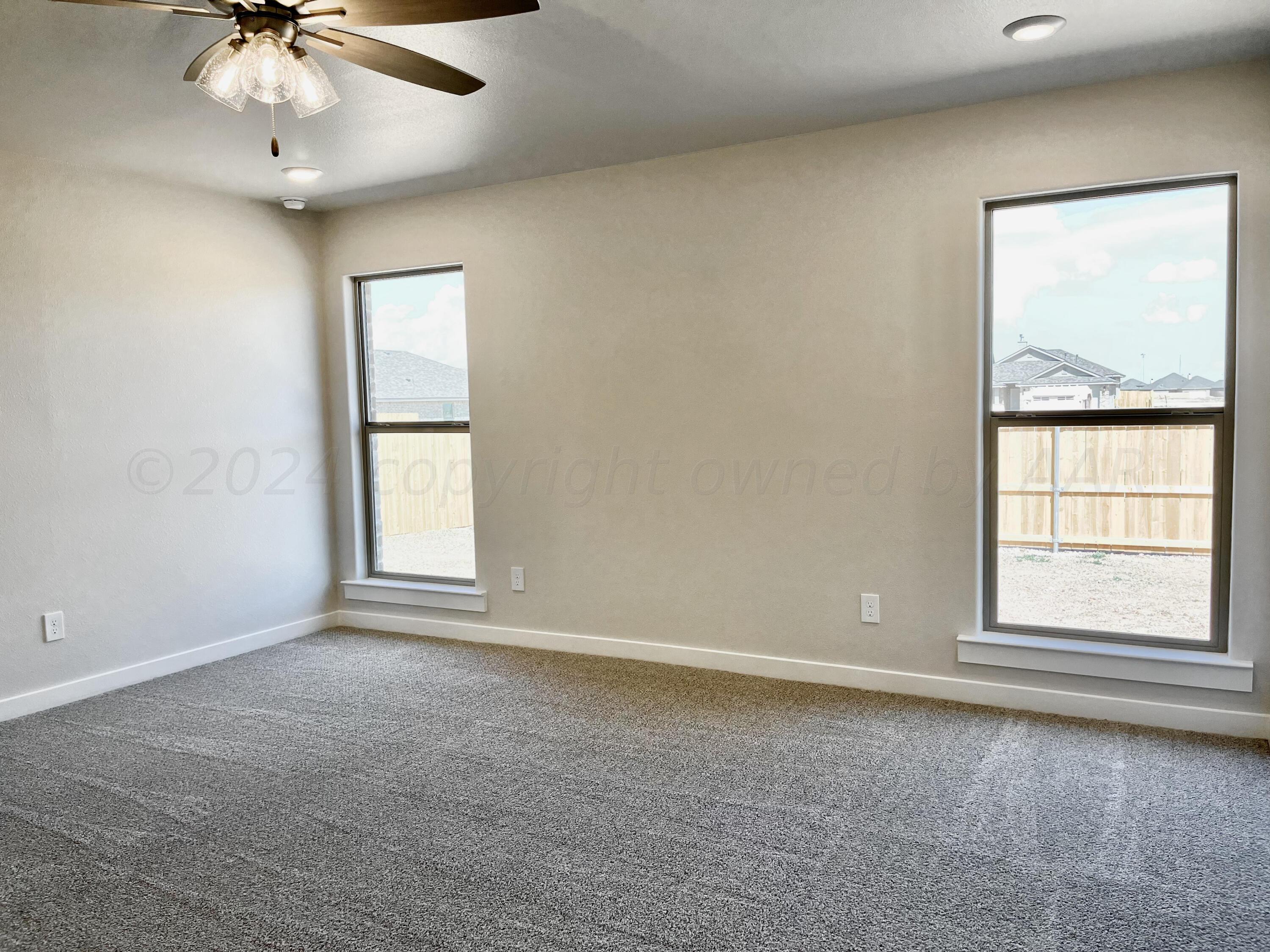 7515 Frazier Road Amarillo, TX 79119 - Photo 10 of 23 an empty room with a window