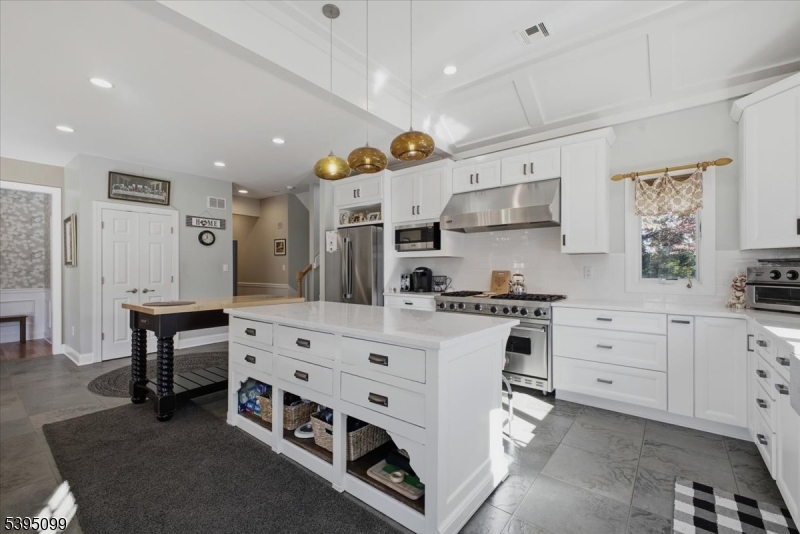 9 Doefield Road Califon, NJ 07830 - Photo 11 of 32 a kitchen with white cabinets and white appliances