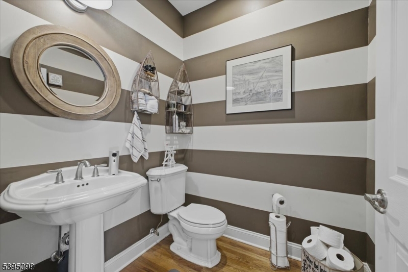 9 Doefield Road Califon, NJ 07830 - Photo 15 of 32 a bathroom with a sink a toilet and a mirror