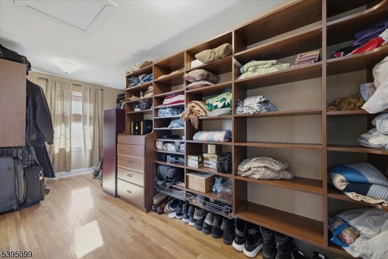 9 Doefield Road Califon, NJ 07830 - Photo 18 of 32 a view of walk in closet with clothes and shoes