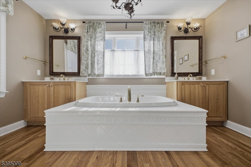 9 Doefield Road Califon, NJ 07830 - Photo 19 of 32 a en suite bathroom with a sink and a mirror