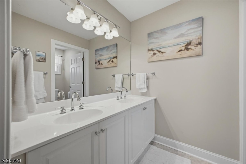 9 Doefield Road Califon, NJ 07830 - Photo 21 of 32 a bathroom with a sink and a mirror