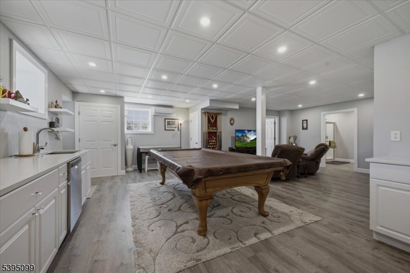 9 Doefield Road Califon, NJ 07830 - Photo 25 of 32 a room with furniture pool table wooden floor and windows