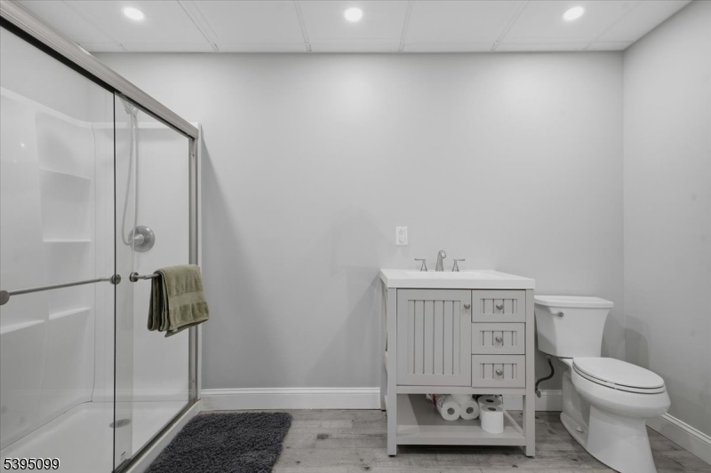 9 Doefield Road Califon, NJ 07830 - Photo 26 of 32 a bathroom with a toilet a sink and mirror