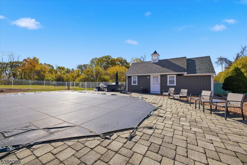 9 Doefield Road Califon, NJ 07830 - Photo 30 of 32 a view of a house with a yard and sitting area