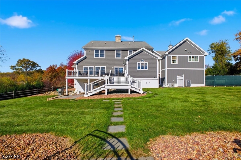 9 Doefield Road Califon, NJ 07830 - Photo 6 of 32 a front view of a house with a yard