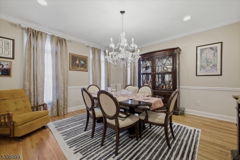 9 Doefield Road Califon, NJ 07830 - Photo 7 of 32 a dining room with furniture a chandelier and wooden floor