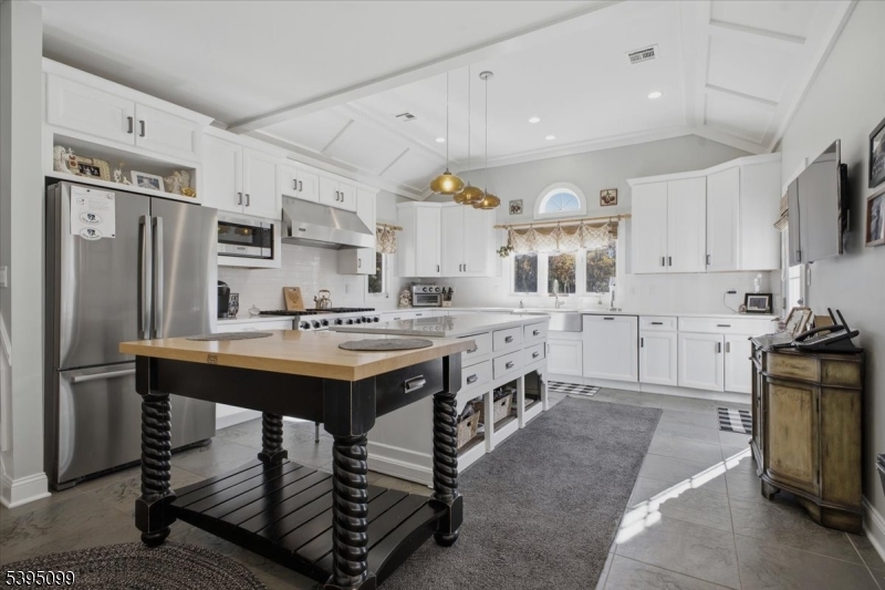 9 Doefield Road Califon, NJ 07830 - Photo 8 of 32 a kitchen with stainless steel appliances a sink a stove a refrigerator and cabinets