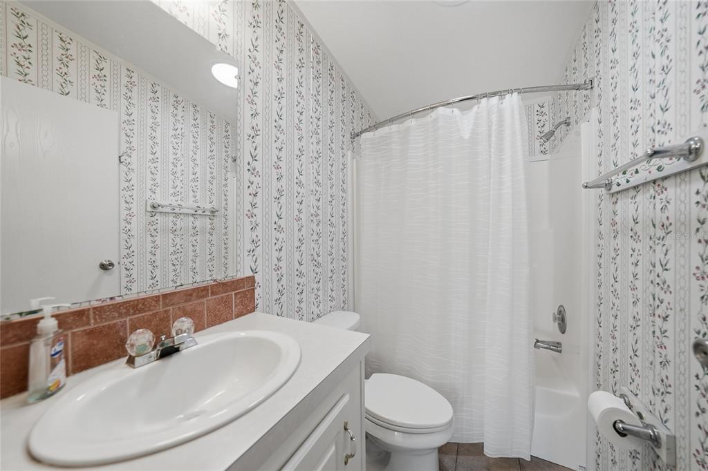 11923 Southwest Loop Terrace Arcadia, FL 34269 - Photo 29 of 50 a bathroom with a sink toilet and shower