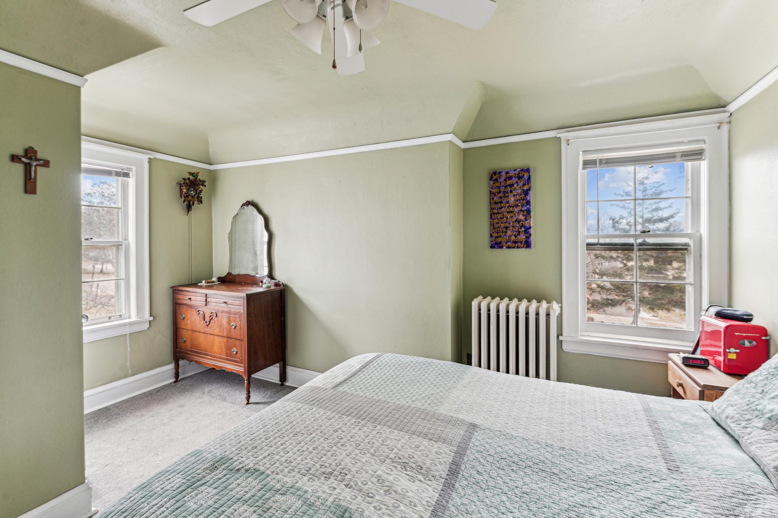 2111 Lakeview Drive Duluth, MN 55803 - Photo 13 of 21 Bedroom with baseboards, radiator heating unit, carpet, and a ceiling fan