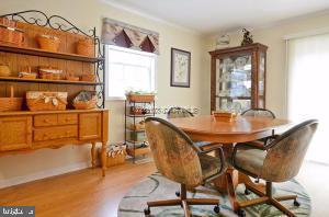 12606 Balte Road Ocean City, MD 21842 - Photo 17 of 51 a dining room view with a table and chairs