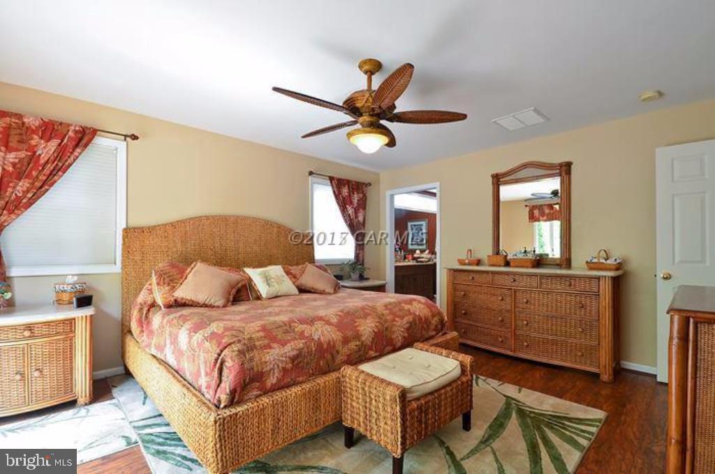 12606 Balte Road Ocean City, MD 21842 - Photo 21 of 51 a bedroom with a bed and a dresser