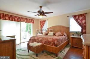 12606 Balte Road Ocean City, MD 21842 - Photo 23 of 51 a bedroom with a bed window and a table