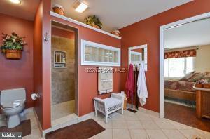 12606 Balte Road Ocean City, MD 21842 - Photo 26 of 51 a bathroom with a toilet and a shower
