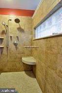 12606 Balte Road Ocean City, MD 21842 - Photo 28 of 51 a bathroom with a toilet and a shower