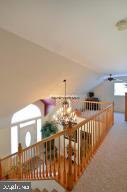 12606 Balte Road Ocean City, MD 21842 - Photo 32 of 51 a view of staircase with railing and white walls