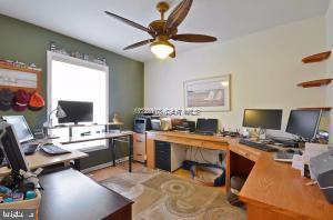 12606 Balte Road Ocean City, MD 21842 - Photo 33 of 51 a workspace with furniture and a flat screen tv