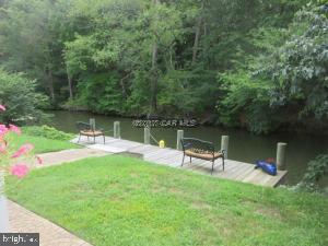 12606 Balte Road Ocean City, MD 21842 - Photo 46 of 51 a view of a lake with a bench and a lake view