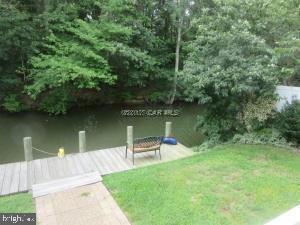 12606 Balte Road Ocean City, MD 21842 - Photo 47 of 51 a view of a lake with a wooden deck and lake