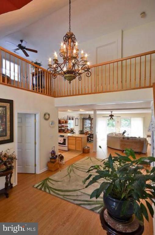 12606 Balte Road Ocean City, MD 21842 - Photo 9 of 51 a room with lots of white furniture and a chandelier