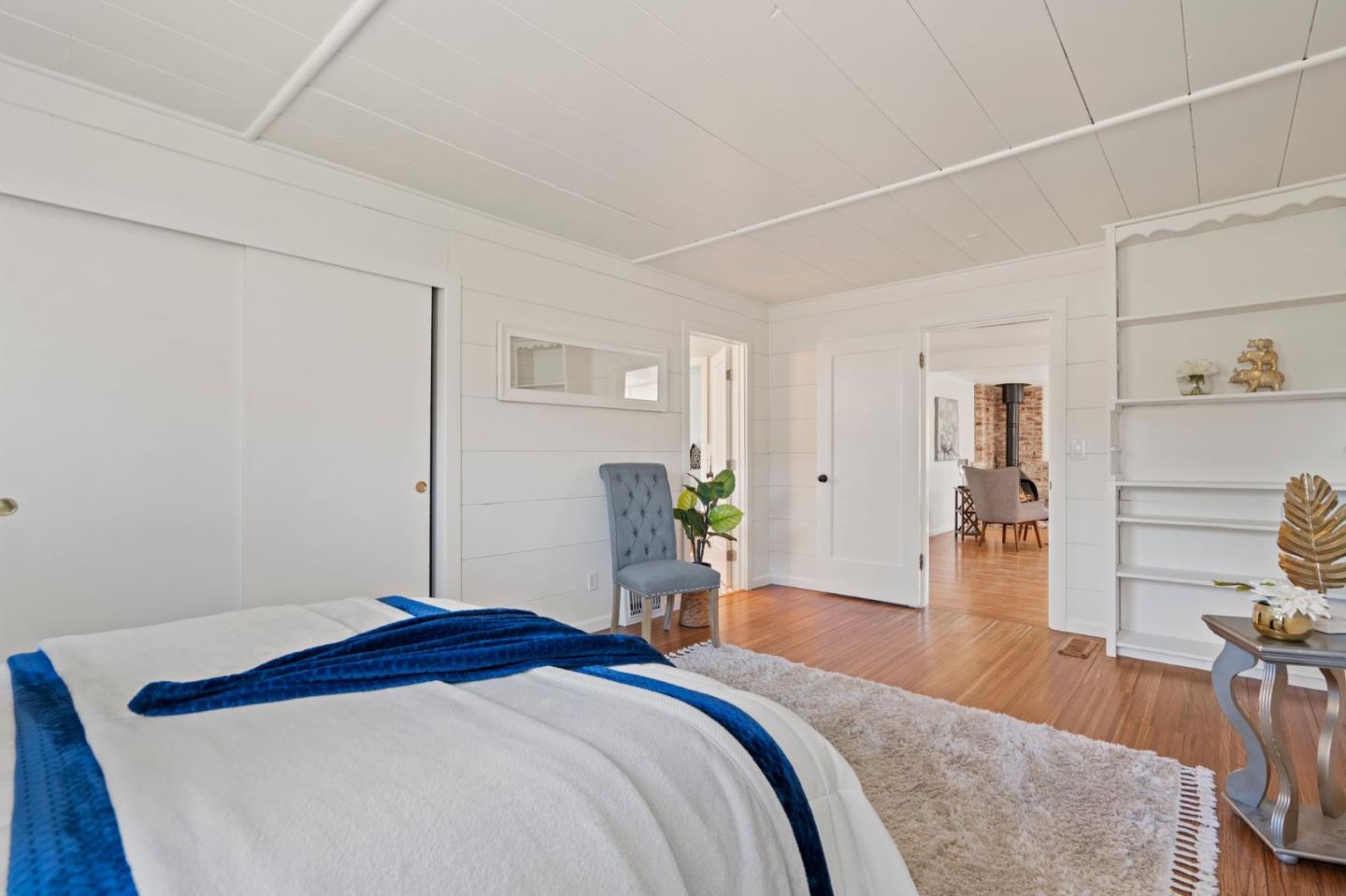 3368 Johnson Road Lafayette, CA 94549 - Photo 29 of 50 a bedroom with a bed and wooden floor