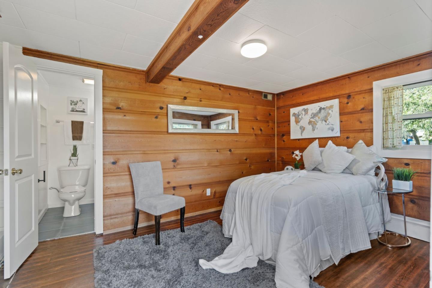 3368 Johnson Road Lafayette, CA 94549 - Photo 36 of 50 a bedroom with a bed and wooden floor