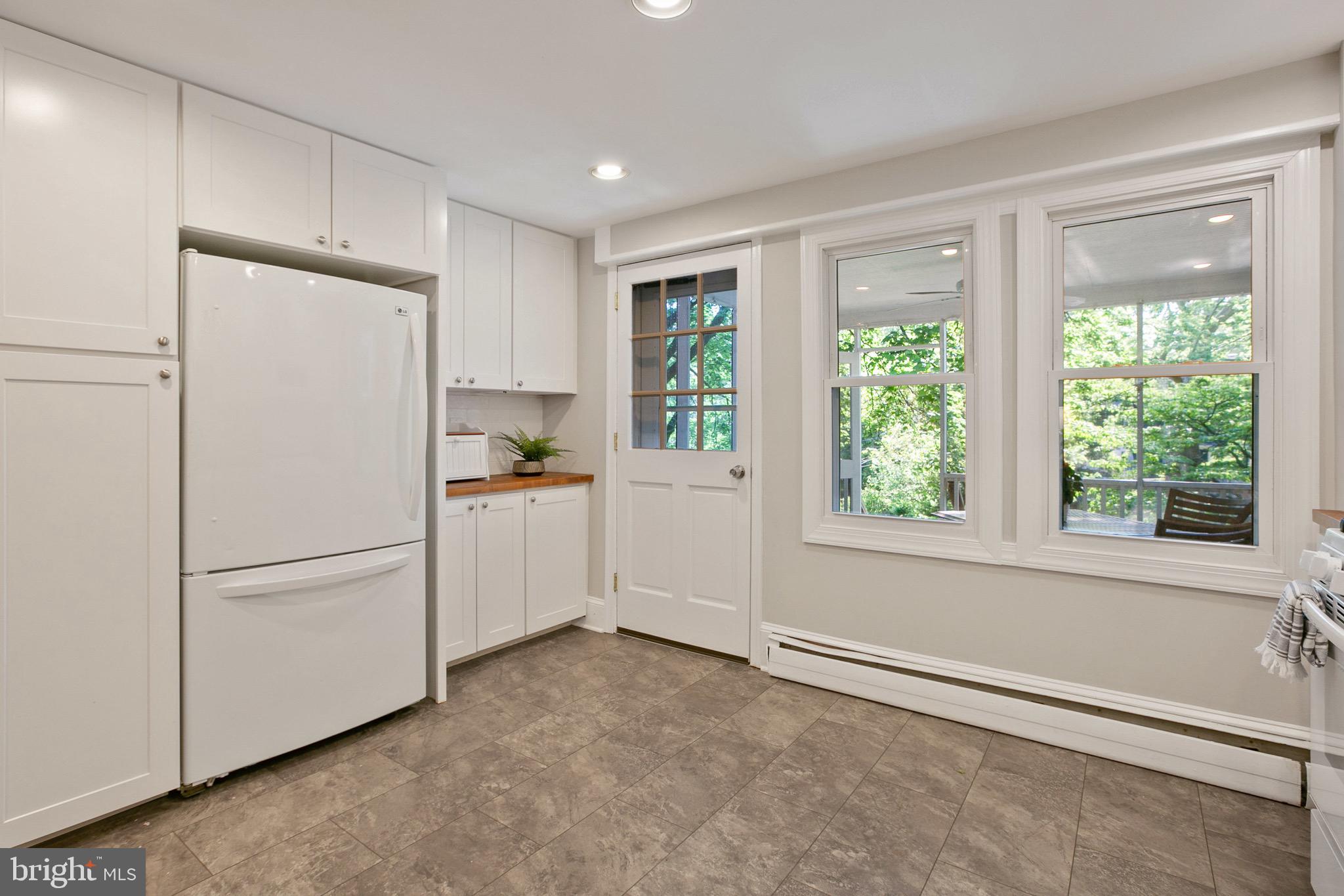 4514 Schenley Road Baltimore, MD 21210 - Photo 14 of 43 Kitchen Leads to Rear Screened Porch