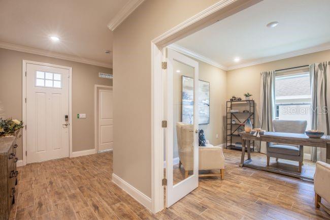 16492 Crane Road Weeki Wachee, FL 34614 - Photo 8 of 24 a view of livingroom with furniture and wooden floor