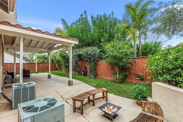 an outdoor space with furniture and umbrella