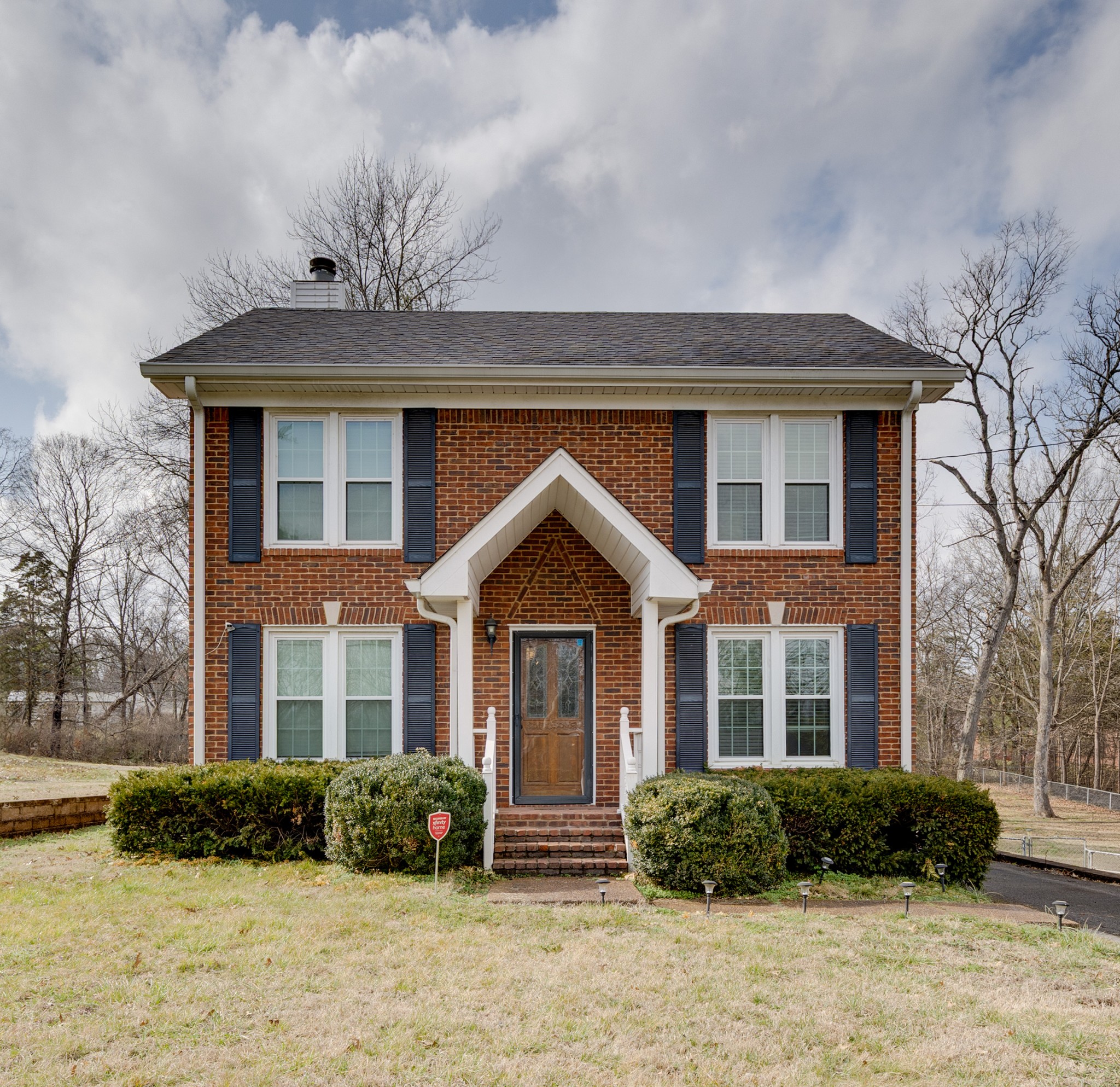 206 West Marthona Road Madison, TN 37115 - Photo 1 of 16 a front view of a house with garden