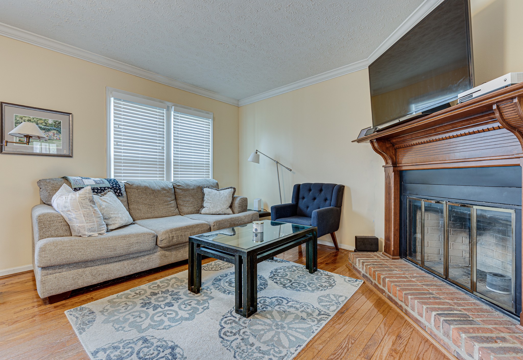 206 West Marthona Road Madison, TN 37115 - Photo 2 of 16 a living room with furniture and a fireplace