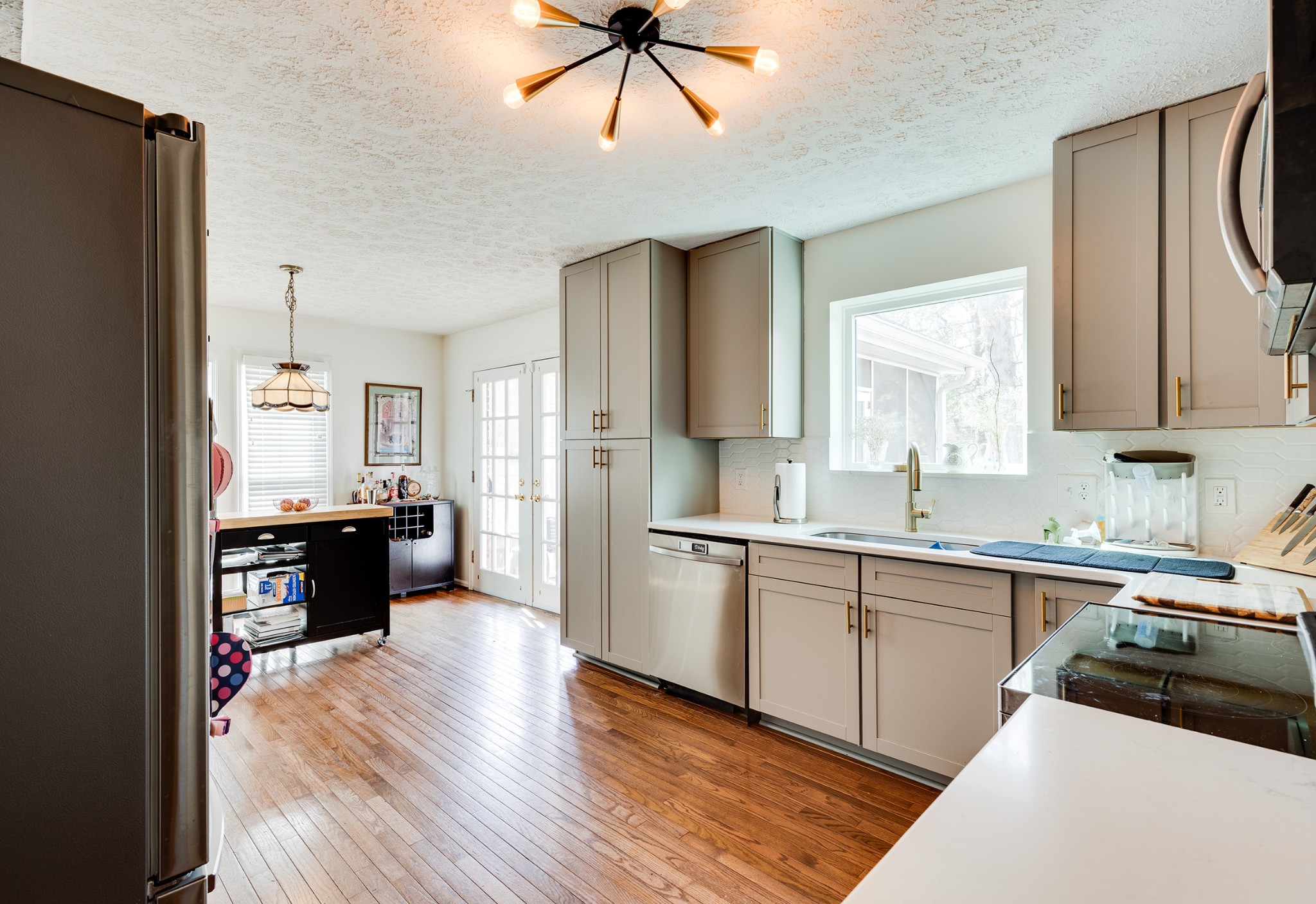 206 West Marthona Road Madison, TN 37115 - Photo 4 of 16 a large kitchen with a large counter top space a sink stainless steel appliances and cabinets
