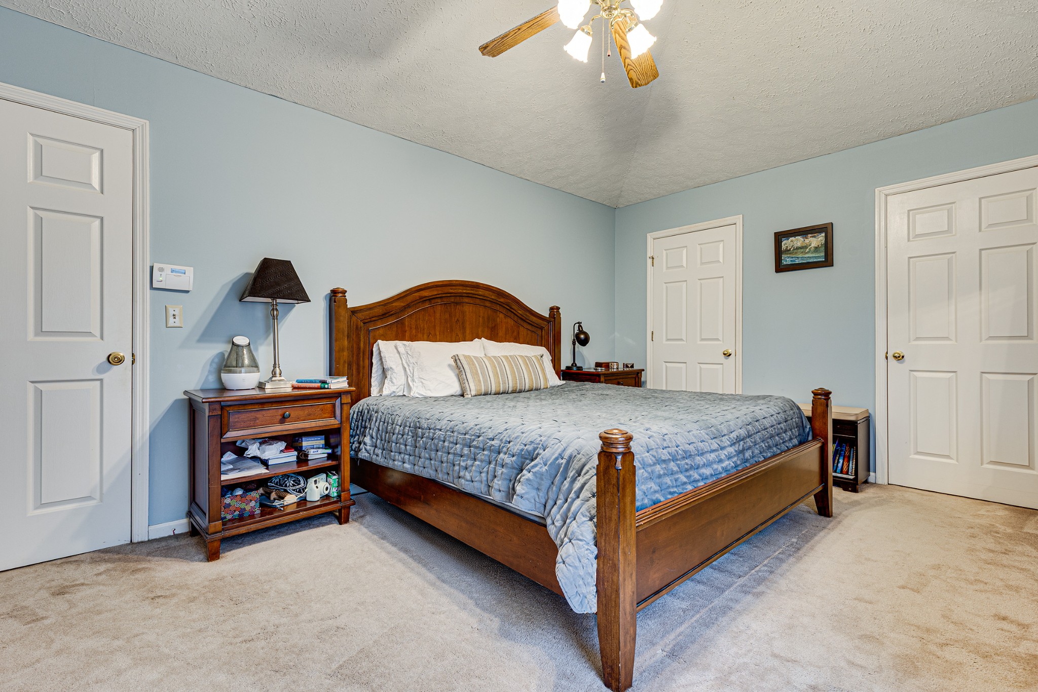 206 West Marthona Road Madison, TN 37115 - Photo 8 of 16 a bedroom with a bed and a chandelier