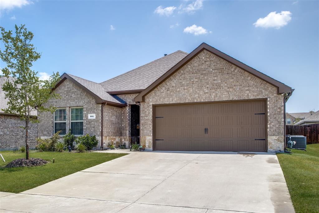 a view of garage yard and tree
