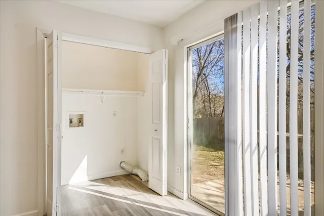 a view of a bathroom with a shower and a window