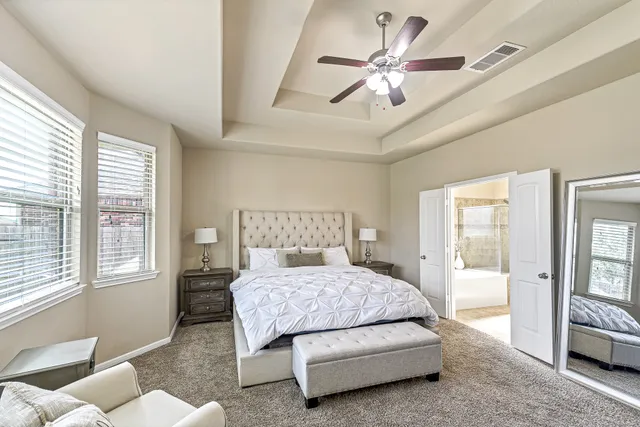 a bedroom with a bed and window